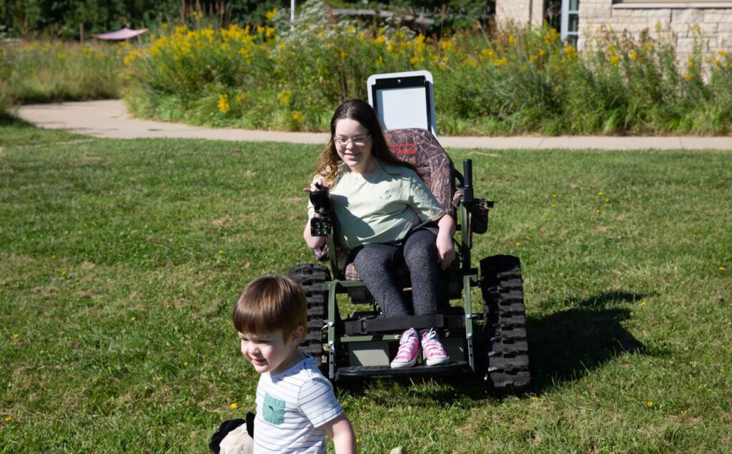 Ryle driving an all-terrain wheelchair