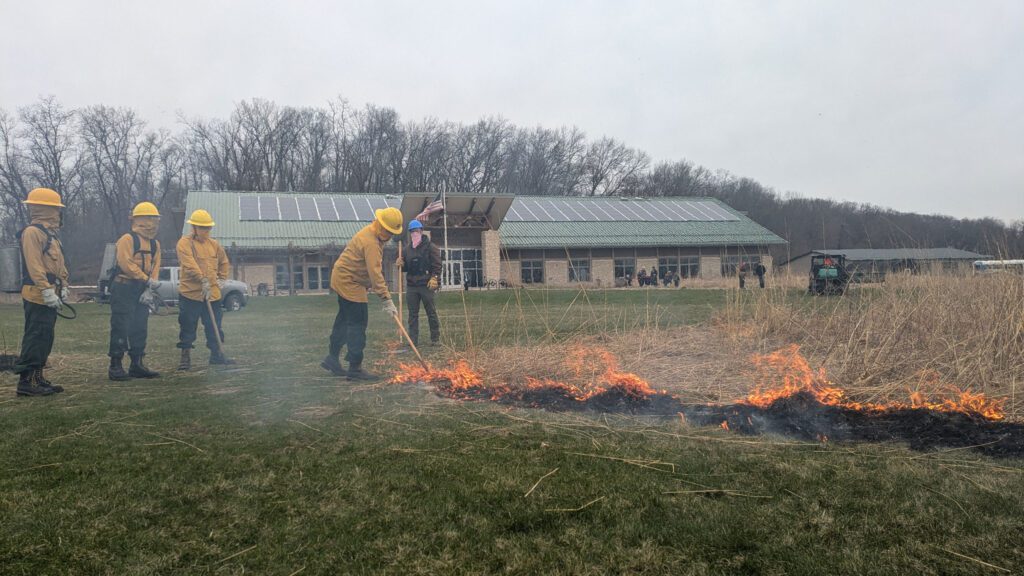 AmeriCorps crew assisting with a controlled burn