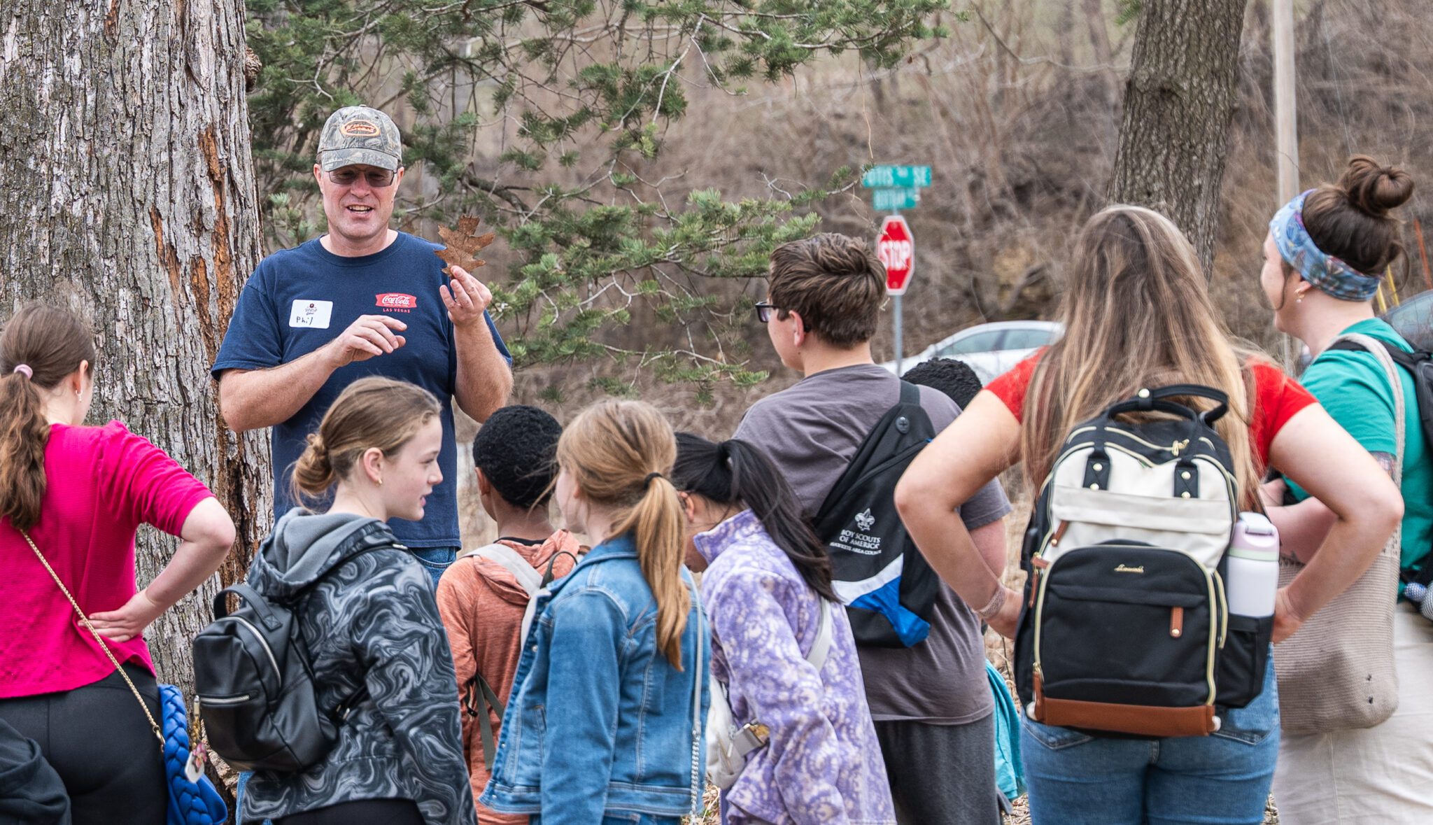 Volunteer leading a maple syruping program